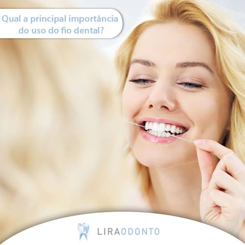 Qual a principal importância do uso do fio dental? - Lira Odonto